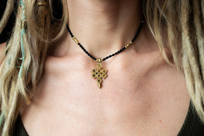 Infinity knot pendant necklace